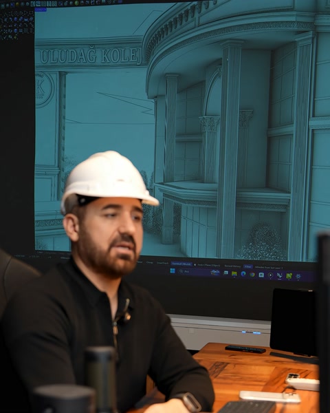Ekranda mavi tonlu bina 3D modeli sunum yapılıyor